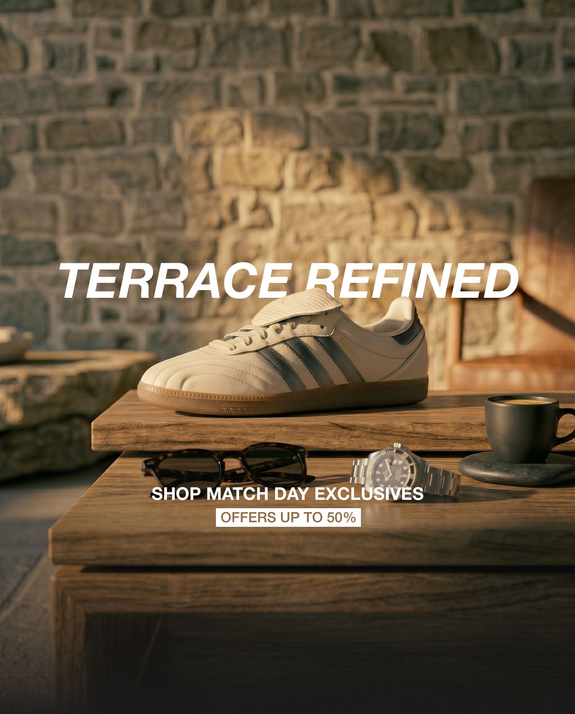 Off-white premium Adidas Samba sneaker with fold-over tongue styled on a wooden table with a luxury watch and sunglasses. Up to 50 percent off World Cup match-day terrace exclusives at Luxuntique Sri Lanka.