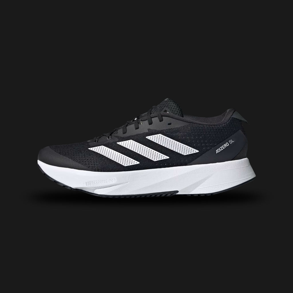Adidas Adizero SL running shoes in Core Black, Cloud White, and Carbon (HQ1349). Features a lightweight, breathable Core Black engineered mesh upper designed for daily training. Includes crisp Cloud White 3-Stripes, a dual-foam midsole combining Lightstrike and Lightstrike Pro cushioning for maximum energy return, and a durable Carbon rubber outsole. Luxuntique guarantees 100% authentic Adidas footwear in Sri Lanka.