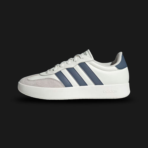 Adidas Barreda shoes in Off White, Preloved Ink, and Grey One (JR1318). Features a classic court-inspired profile with a durable synthetic upper, breathable perforations, and a supportive rubber cupsole for stability. Luxuntique guarantees 100% authentic "Adidas" footwear in Sri Lanka.