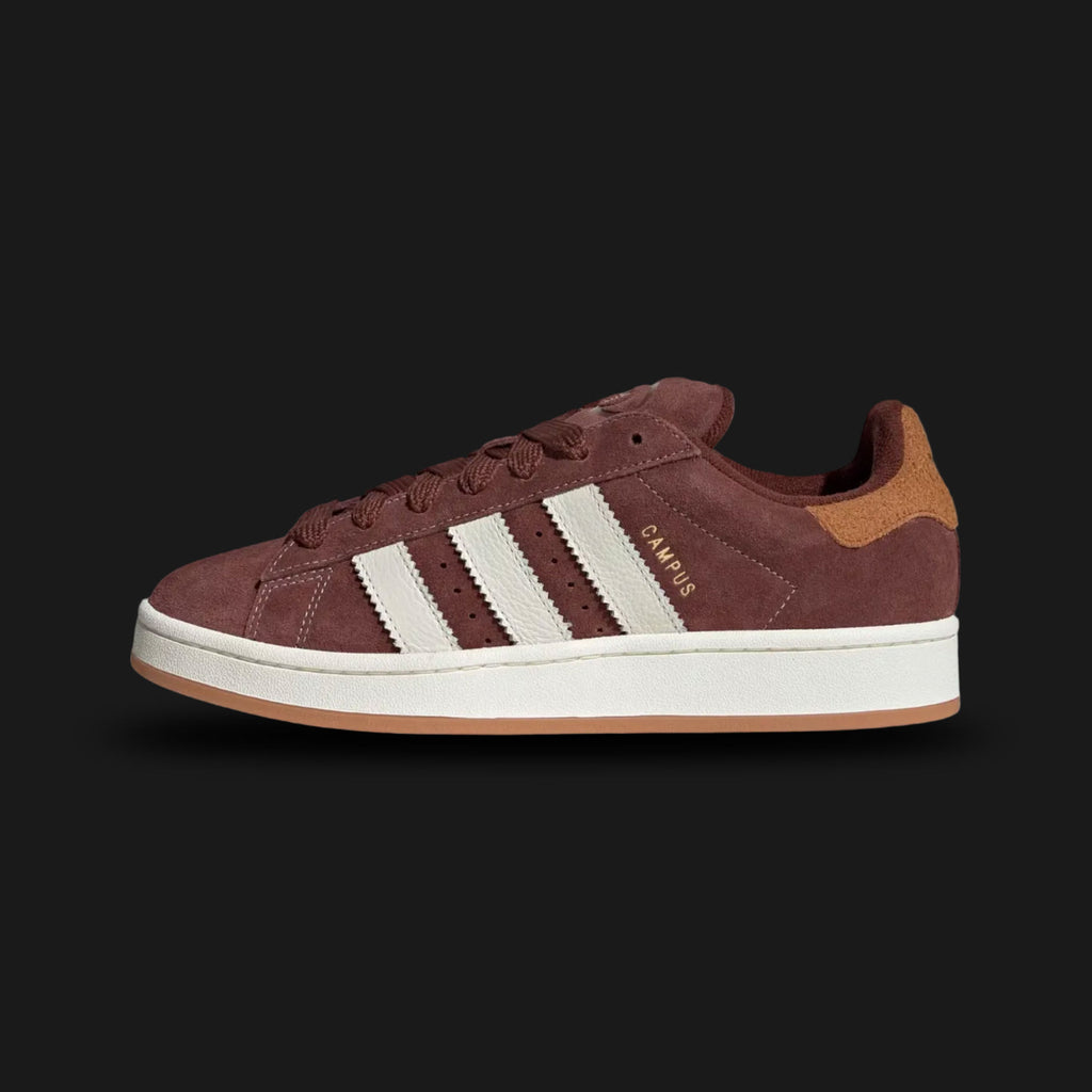 adidas Campus 00s shoes in Fox Brown, Off White, and Rustic Orange (Design Code: JS3785). Featuring a chunky Y2K-inspired silhouette, a premium Fox Brown suede upper with oversized Off White three-stripes, and a durable gum rubber outsole. Detailed with Rustic Orange accents and thick laces. Luxuntique offers 100% authentic adidas Campus 00s sneakers at the lowest price in Sri Lanka.