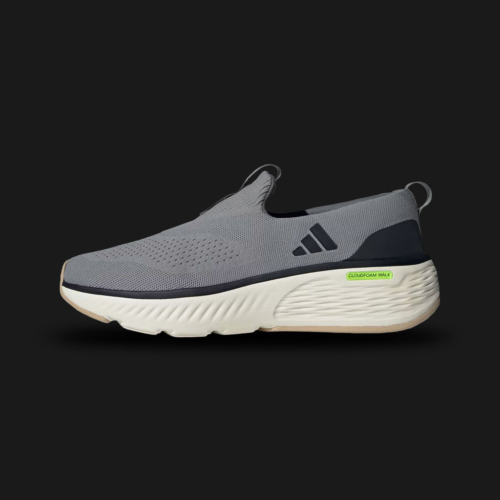 Adidas Cloudfoam Go Lounger shoes in Grey Three, Core Black, and Off White (ID4021). Features a laceless textile upper with suede overlays, plush Cloudfoam cushioning midsole, and a durable rubber outsole for easy slip-on comfort. Luxuntique guarantees 100% authentic footwear.