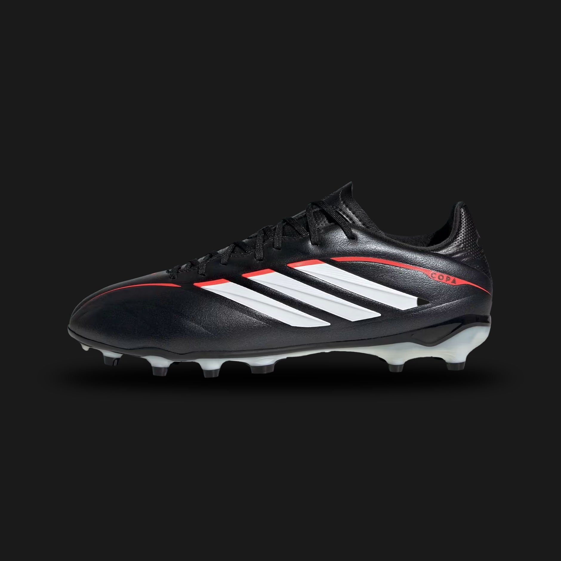Adidas Copa Pure IV League Firm Ground kids football boots in Core Black, Cloud White, and Lucid Red (JR6265). Features a comfortable synthetic leather upper with classic forefoot stitching for enhanced ball touch. Includes crisp Cloud White 3-Stripes, a U-throat collar for easy entry, and a durable Firm Ground (FG) soleplate with Lucid Red stud accents. Luxuntique guarantees 100% authentic Adidas footwear in Sri Lanka.