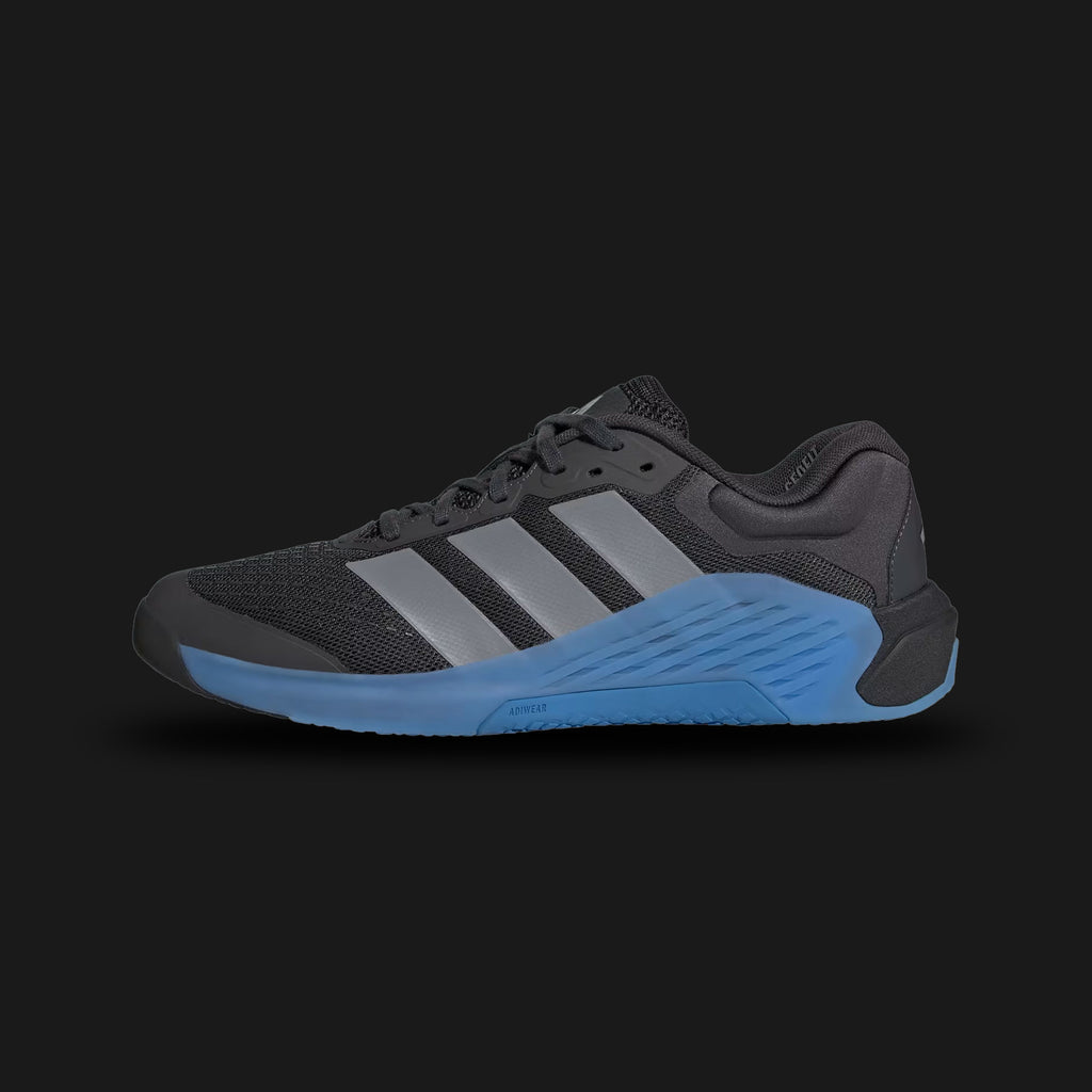 Adidas Dropset 4 Training Shoes in Carbon, Grey, and Ray Blue (JR4681). Features a breathable mesh upper with durable haptic print, a full-length Repetitor foam midsole, and Energyrods for stability. Includes Geofit heel support, Footadapt sockliner, and a Continental™ rubber outsole for high traction. Luxuntique offers 100% authentic Adidas in Sri Lanka.