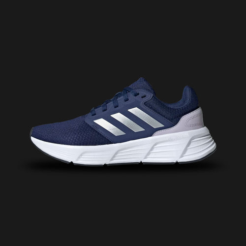 Adidas Galaxy 6 shoes in Dark Blue and Silver Metallic (IE8146). Features a breathable OrthoLite sockliner, a plush Cloudfoam cushioned midsole for step-in comfort, and a durable rubber outsole for reliable multi-surface grip. Luxuntique guarantees 100% authentic "Adidas" footwear in Sri Lanka.