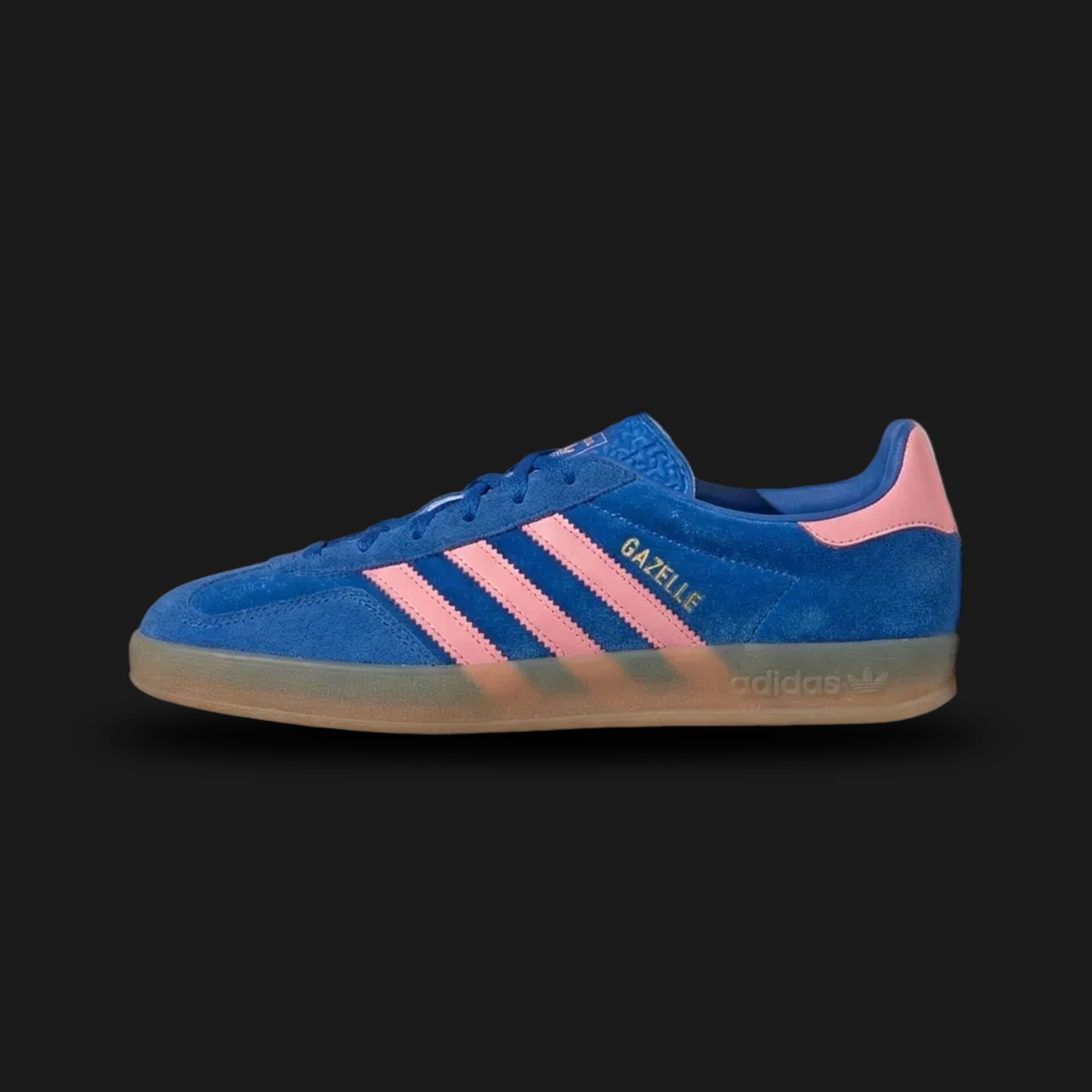 adidas Gazelle Indoor shoes in Blue and Semi Pink Spark with a translucent gum sole (Design Code: IG6785). Featuring a premium blue suede upper, vibrant pink leather three-stripes, and iconic gold foil branding. Includes a soft leather lining and the signature Indoor translucent gum rubber outsole. Luxuntique offers 100% authentic adidas Gazelle Indoor sneakers at the lowest price in Sri Lanka.