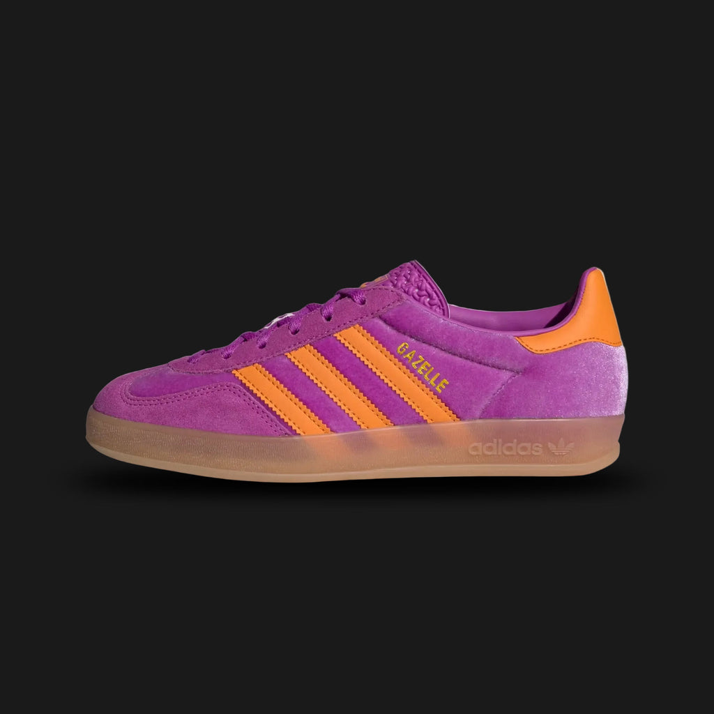 Adidas Gazelle Indoor shoes in Purple Burst, Eqt Orange, and Gum (Design Code: IH0277). Featuring a premium suede upper in deep purple, vibrant orange leather three-stripes, and the iconic translucent gum rubber outsole. Includes a soft leather lining for comfort. Luxuntique offers 100% authentic Adidas Gazelle Indoor sneakers at the lowest price in Sri Lanka.