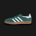 Adidas Gazelle Indoor shoes in Collegiate Green, Cloud White, and Gum (JI2062). Features a premium forest green suede upper with crisp white leather Three Stripes, gold foil Gazelle branding, and the signature translucent gum rubber outsole. A classic terrace-culture silhouette. Luxuntique offers 100% authentic Adidas in Sri Lanka.