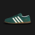 Adidas Gazelle Lo Pro shoes in Collegiate Green, Cloud White, and Gum (JS1194). Features a premium forest green suede upper with crisp white leather Three Stripes and gold foil branding. Designed with a streamlined low-profile gum rubber outsole. Luxuntique offers 100% authentic Adidas in Sri Lanka.