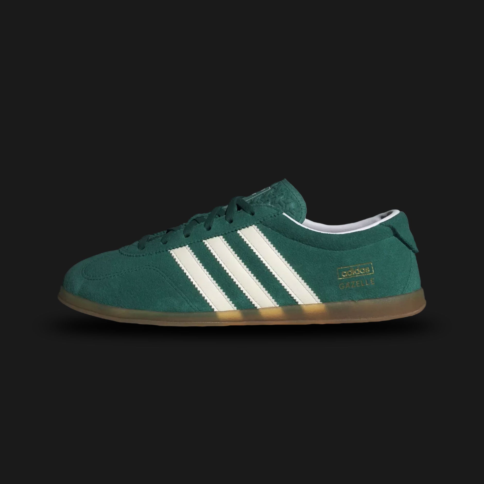 Adidas Gazelle Lo Pro shoes in Collegiate Green, Cloud White, and Gum (JS1194). Features a premium forest green suede upper with crisp white leather Three Stripes and gold foil branding. Designed with a streamlined low-profile gum rubber outsole. Luxuntique offers 100% authentic Adidas in Sri Lanka.