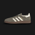 adidas Handball Spezial shoes in Olive Strata green, Cream White, and Gum (Design Code: JR2121). Featuring a premium olive green suede upper, contrast cream leather three-stripes, and a signature gum rubber outsole for a classic indoor-sports-turned-lifestyle look. Luxuntique offers 100% authentic adidas Spezial sneakers at the lowest price in Sri Lanka.