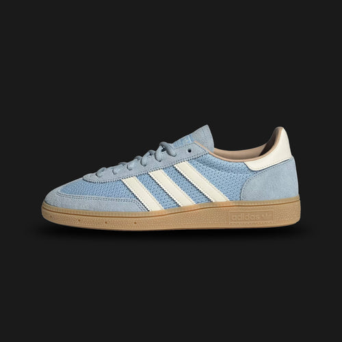 Adidas Handball Spezial shoes in Clear Sky, Cream White, and Warm Sandstone (JS3866). Features a classic terrace silhouette with a premium Clear Sky blue suede upper and the signature T-toe overlay. Includes crisp Cream White 3-Stripes, Warm Sandstone accents, and a retro Gum rubber traction outsole. Luxuntique guarantees 100% authentic Adidas footwear in Sri Lanka.