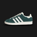 Adidas Jabbar Lo shoes in Aurora Ivy and Off White (JR4354). Features a premium smooth leather upper in forest green with serrated off-white 3-Stripes and a suede T-toe overlay. Classic low-profile 1970s basketball silhouette with an aged-look rubber cupsole and Kareem Abdul-Jabbar tongue branding. Luxuntique offers 100% authentic Adidas in Sri Lanka.