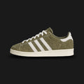 Adidas Jabbar Lo shoes in Olive Strata, Off White, and Cream White (JS2160). Features a premium smooth leather upper in earthy olive green with serrated off-white 3-Stripes and a signature suede T-toe overlay. Classic low-profile 1970s basketball silhouette with an aged-look cream rubber cupsole and Kareem Abdul-Jabbar tongue branding. Luxuntique offers 100% authentic Adidas in Sri Lanka.