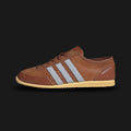 Adidas Japan Decon shoes in Dusky Bronze, Crystal Sky, and Orange Tint (IH1622). Features a premium deconstructed soft leather upper in Dusky Bronze with light blue Crystal Sky Three Stripes. Ultra-flexible, low-profile design with a slim rubber outsole. Luxuntique offers 100% authentic Adidas in Sri Lanka.