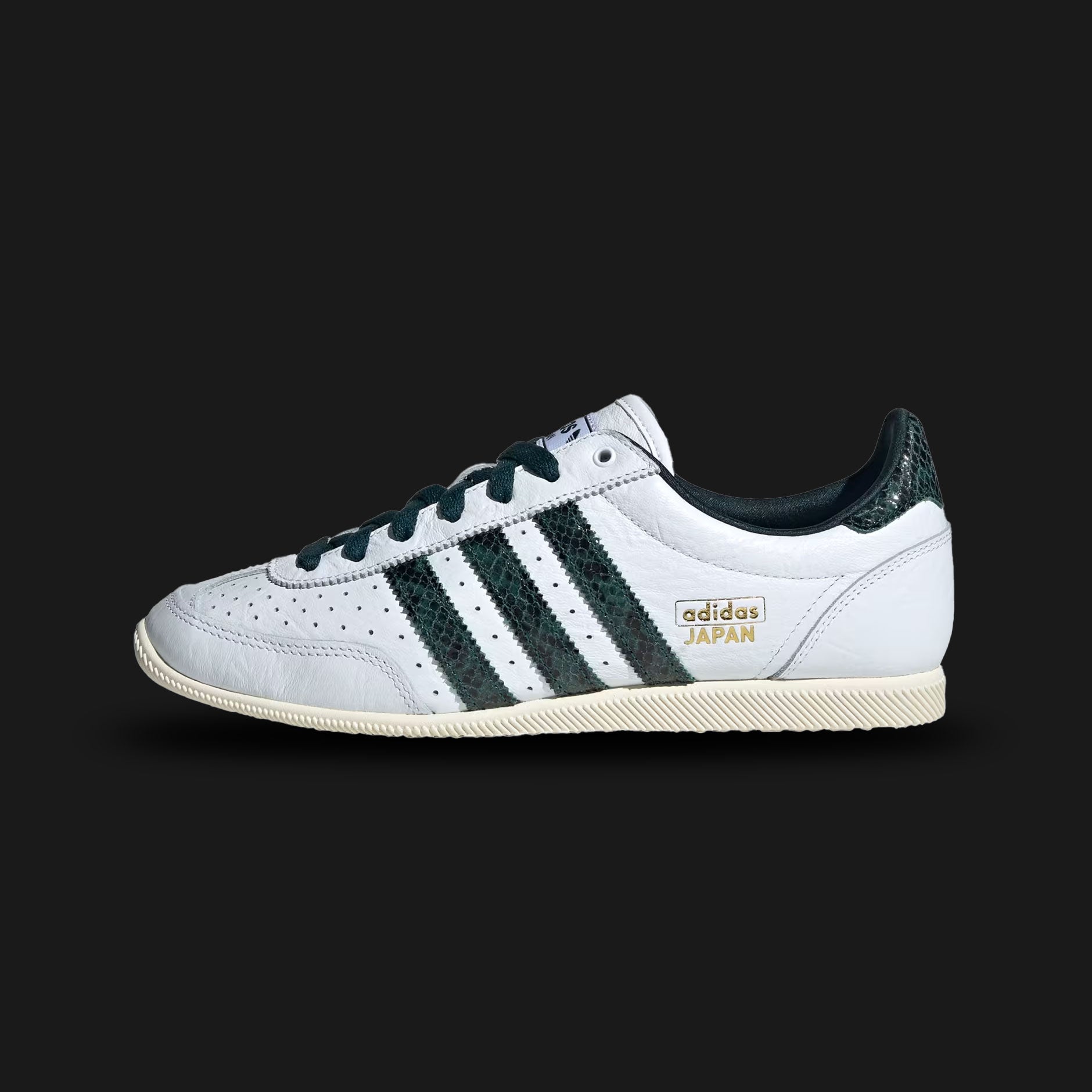 Adidas Japan vintage shoes in Cloud White, Collegiate Green, and Aurora Ivy (JQ9062). Features a sleek 1964 heritage low-profile silhouette with a premium Cloud White leather upper and a classic suede T-toe overlay. Includes crisp Collegiate Green and Aurora Ivy 3-Stripes, vintage branding, and a slim rubber traction outsole. Luxuntique guarantees 100% authentic Adidas footwear in Sri Lanka.