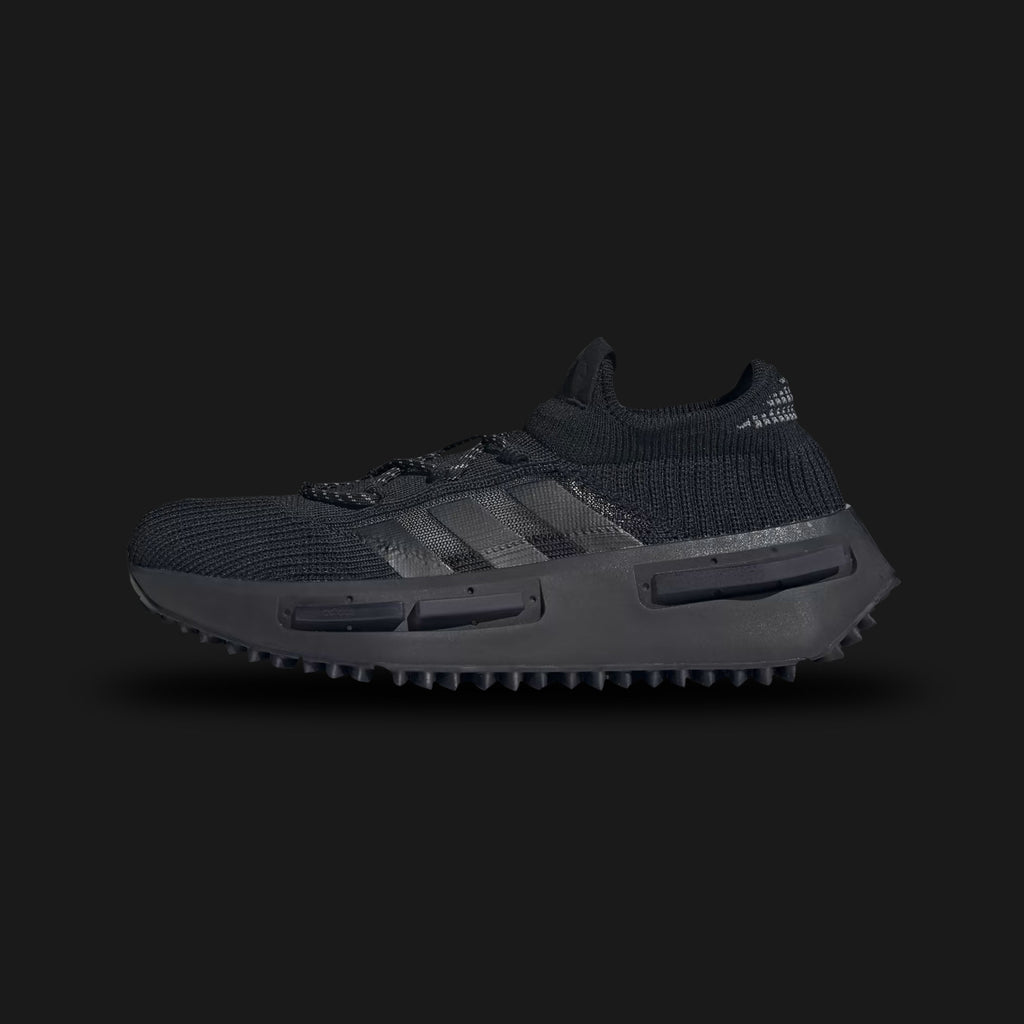 Adidas NMD_S1 shoes in Core Black, Grey Four, and Cloud White (FZ6381). Features a 3D Primeknit sock-like upper, translucent TPU midsole cage with full-length BOOST cushioning, and a rugged Trefoil lug rubber outsole. Luxuntique guarantees 100% authentic footwear.