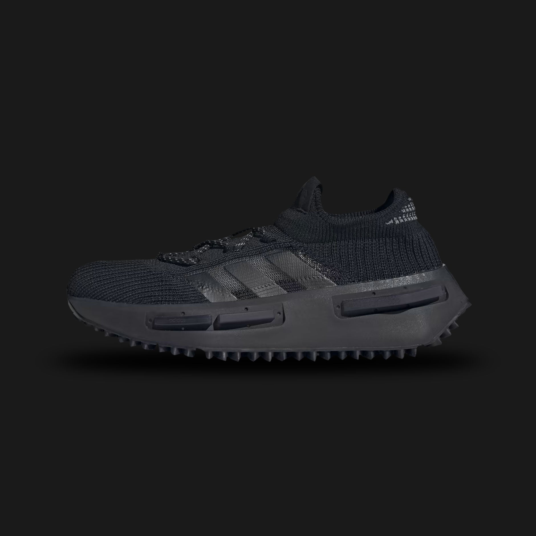 Adidas NMD_S1 shoes in Core Black, Grey Four, and Cloud White (FZ6381). Features a 3D Primeknit sock-like upper, translucent TPU midsole cage with full-length BOOST cushioning, and a rugged Trefoil lug rubber outsole. Luxuntique guarantees 100% authentic footwear.