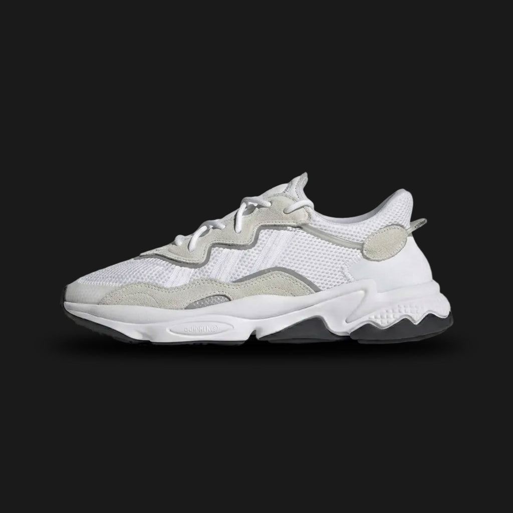 Adidas OZWEEGO shoes in Cloud White and Core Black (Design Code: EE6464). Featuring a layered mesh, suede, and TPU upper, Adiprene+ forefoot cushioning, and Adiprene heel cushioning for ultimate impact absorption. Includes the signature translucent nylon support tube and a chunky 90s-inspired EVA midsole. Luxuntique offers 100% authentic Adidas OZWEEGO sneakers at the lowest price in Sri Lanka.
