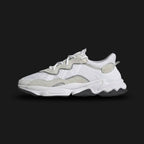 Adidas OZWEEGO shoes in Cloud White and Core Black (Design Code: EE6464). Featuring a layered mesh, suede, and TPU upper, Adiprene+ forefoot cushioning, and Adiprene heel cushioning for ultimate impact absorption. Includes the signature translucent nylon support tube and a chunky 90s-inspired EVA midsole. Luxuntique offers 100% authentic Adidas OZWEEGO sneakers at the lowest price in Sri Lanka.