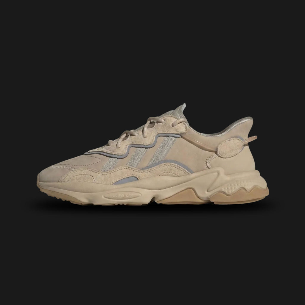 Adidas OZWEEGO shoes in Pale Nude, Light Brown, and Solar Red (Design Code: EE6462). Featuring a signature 90s heritage silhouette with a mesh, suede, and TPU upper. Includes Adiprene+ cushioning in the heel and Adiprene in the forefoot for maximum comfort, with iconic translucent nylon support tubes. Luxuntique offers 100% authentic Adidas OZWEEGO sneakers at the lowest price in Sri Lanka.