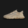 Adidas OZWEEGO shoes in Pale Nude, Light Brown, and Solar Red (Design Code: EE6462). Featuring a signature 90s heritage silhouette with a mesh, suede, and TPU upper. Includes Adiprene+ cushioning in the heel and Adiprene in the forefoot for maximum comfort, with iconic translucent nylon support tubes. Luxuntique offers 100% authentic Adidas OZWEEGO sneakers at the lowest price in Sri Lanka.