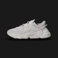 Adidas OZWEEGO shoes in Chalk Pearl and Cloud White (FY2023). Features a retro-futuristic layered upper with premium suede, mesh, and TPU overlays. Includes the signature translucent nylon support tube, Adiprene+ forefoot cushioning, and Adiprene heel cushioning in a chunky EVA midsole. Luxuntique offers 100% authentic Adidas in Sri Lanka.