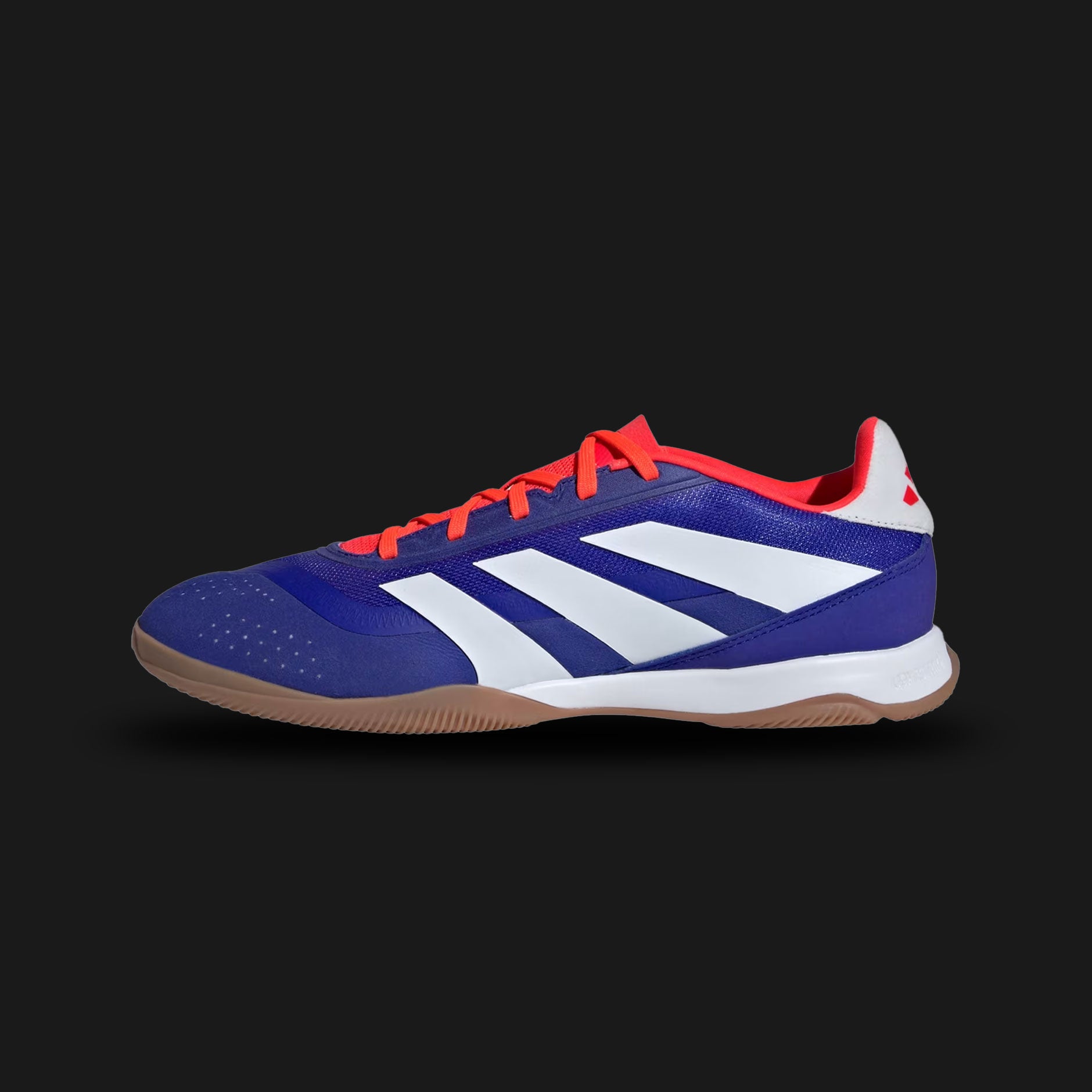 adidas Predator League Indoor football boots in Lucid Blue, Cloud White, and Solar Red (Design Code: IF6393). Featuring a textured synthetic upper with Strikeskin grip elements for precision ball control, colored in electric Lucid Blue with aggressive Solar Red accents. Built with a non-marking rubber outsole designed for maximum traction on flat indoor courts and polished surfaces. Luxuntique offers 100% authentic adidas futsal boots at the lowest price in Sri Lanka.