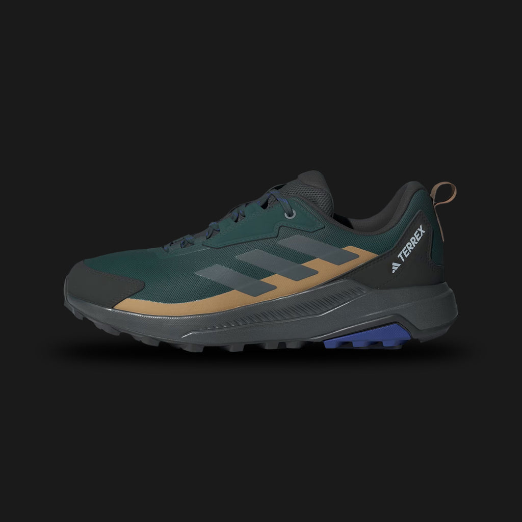 Adidas Terrex Anylander Hiking Shoes in Aurora Ivy, Grey Six, and Cardboard (JQ9954). Features a durable textile upper with synthetic overlays and a gusseted tongue to keep out debris. Includes a lightweight EVA midsole for cushioning and a high-traction Traxion outsole for grip on uneven terrain. Reinforced toe cap for protection. Luxuntique offers 100% authentic Adidas in Sri Lanka.