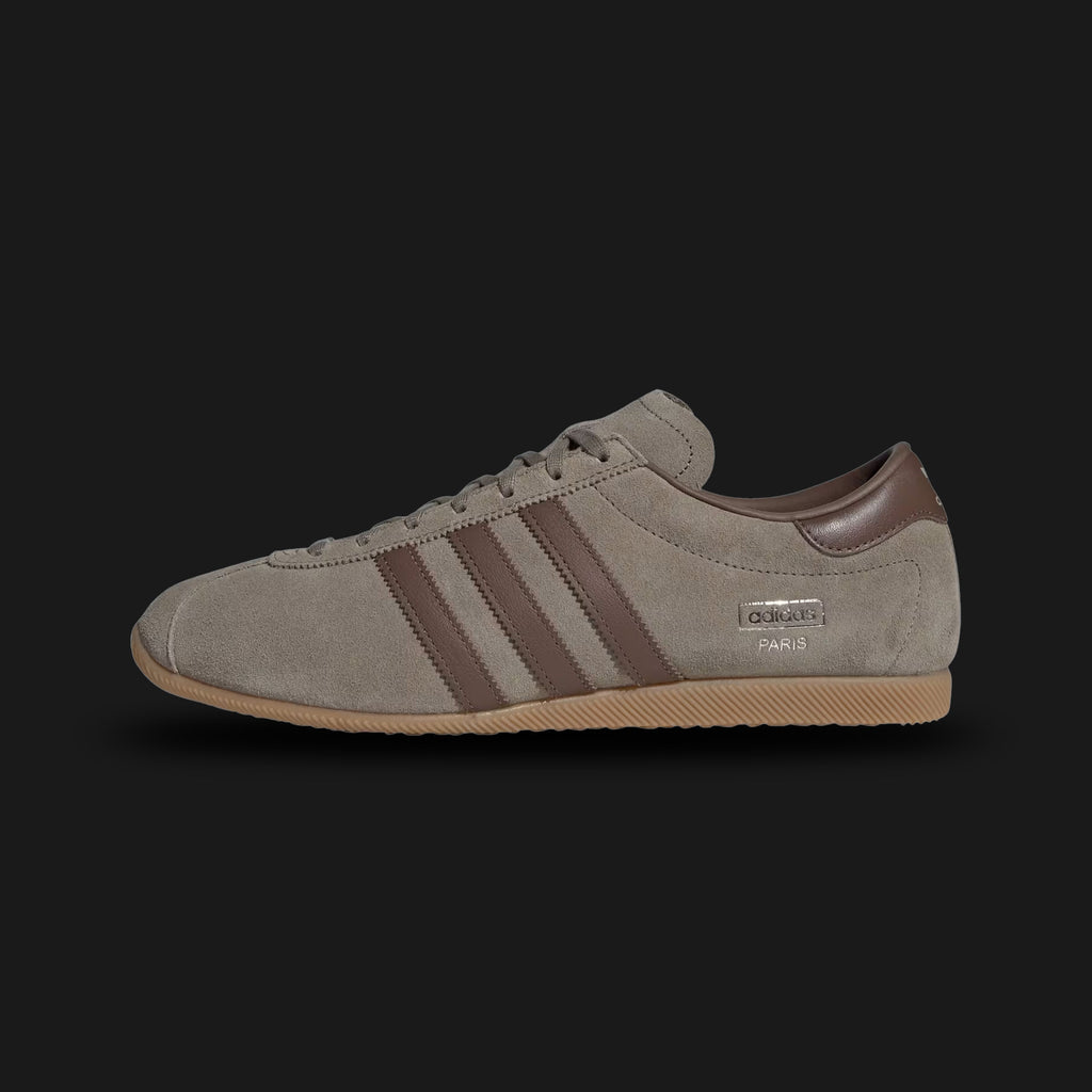 Adidas Rekord shoes in Clay, Earth Strata, and Gum (KJ1013). Features a premium clay-colored leather upper with dark Earth Strata brown Three Stripes and a classic low-profile gum rubber outsole. A minimalist 1970s archival silhouette with a refined, earthy aesthetic. Luxuntique offers 100% authentic Adidas in Sri Lanka.