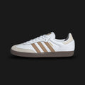 Adidas Samba OG shoes in Cloud White, Cardboard tan, and Gum (Design Code: JR0912). Featuring a premium leather upper, a classic suede T-toe overlay in Cardboard brown, and a signature gum rubber outsole. Luxuntique offers 100% authentic Adidas Samba sneakers at the lowest price in Sri Lanka.