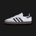 Adidas Samba OG shoes in Cloud White, Core Black, and Clear Granite (B75806). Features a full-grain leather upper, suede T-toe overlay, contrasting serrated 3-Stripes, and an iconic gum rubber outsole. Luxuntique guarantees 100% authentic footwear.