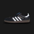 Adidas Samba OG shoes in Core Black, Cloud White, and Gum (B75807). Features a full-grain leather upper, suede T-toe overlay, contrasting serrated 3-Stripes, and an iconic gum rubber outsole. Luxuntique guarantees 100% authentic footwear.