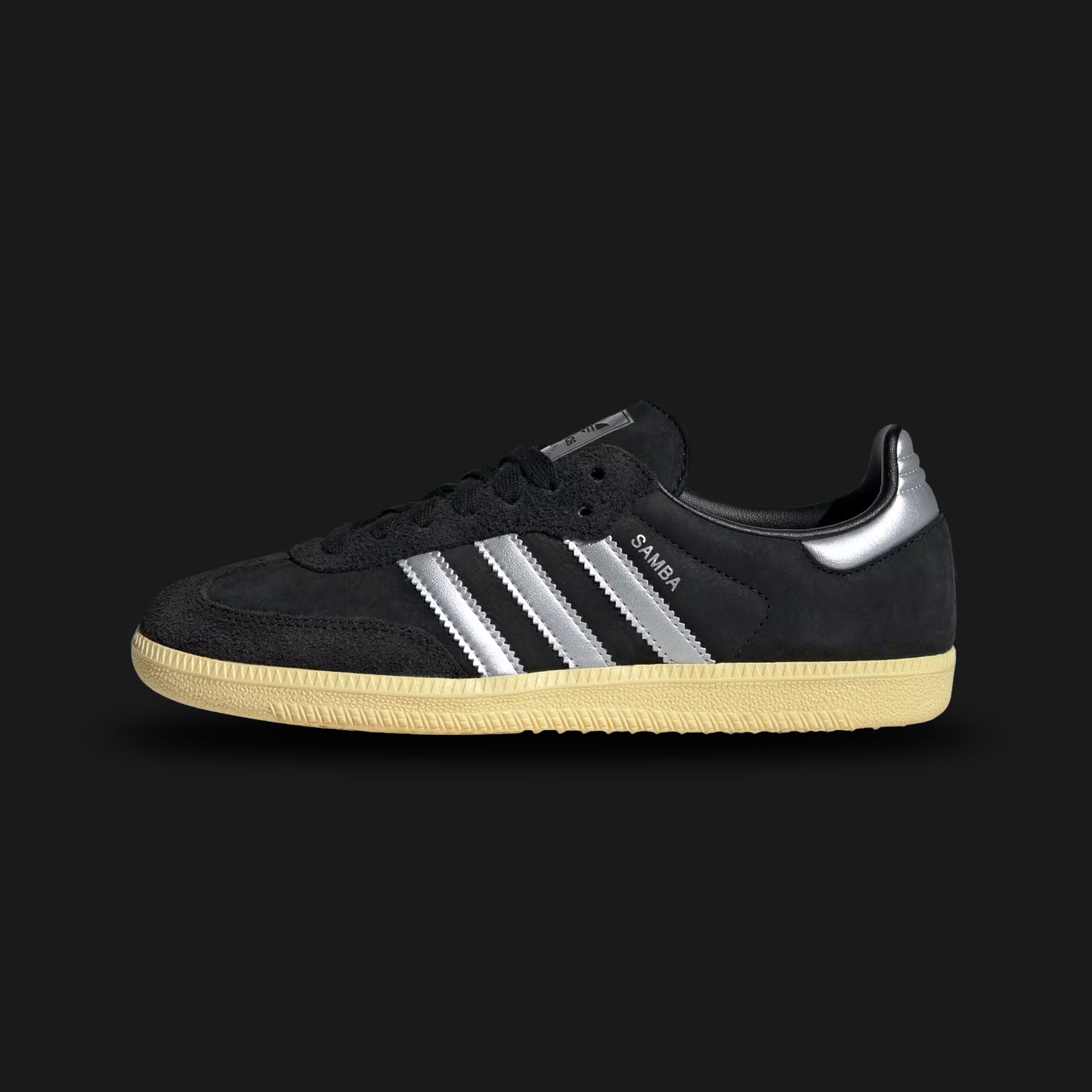 Adidas Samba OG shoes in Core Black, Matte Silver, and Almost Yellow (IE8128). Features a classic low-profile terrace design with a premium leather upper, a contrast suede T-toe overlay, matte silver Three-Stripes, and a durable gum rubber sole. Luxuntique guarantees 100% authentic footwear in Sri Lanka.