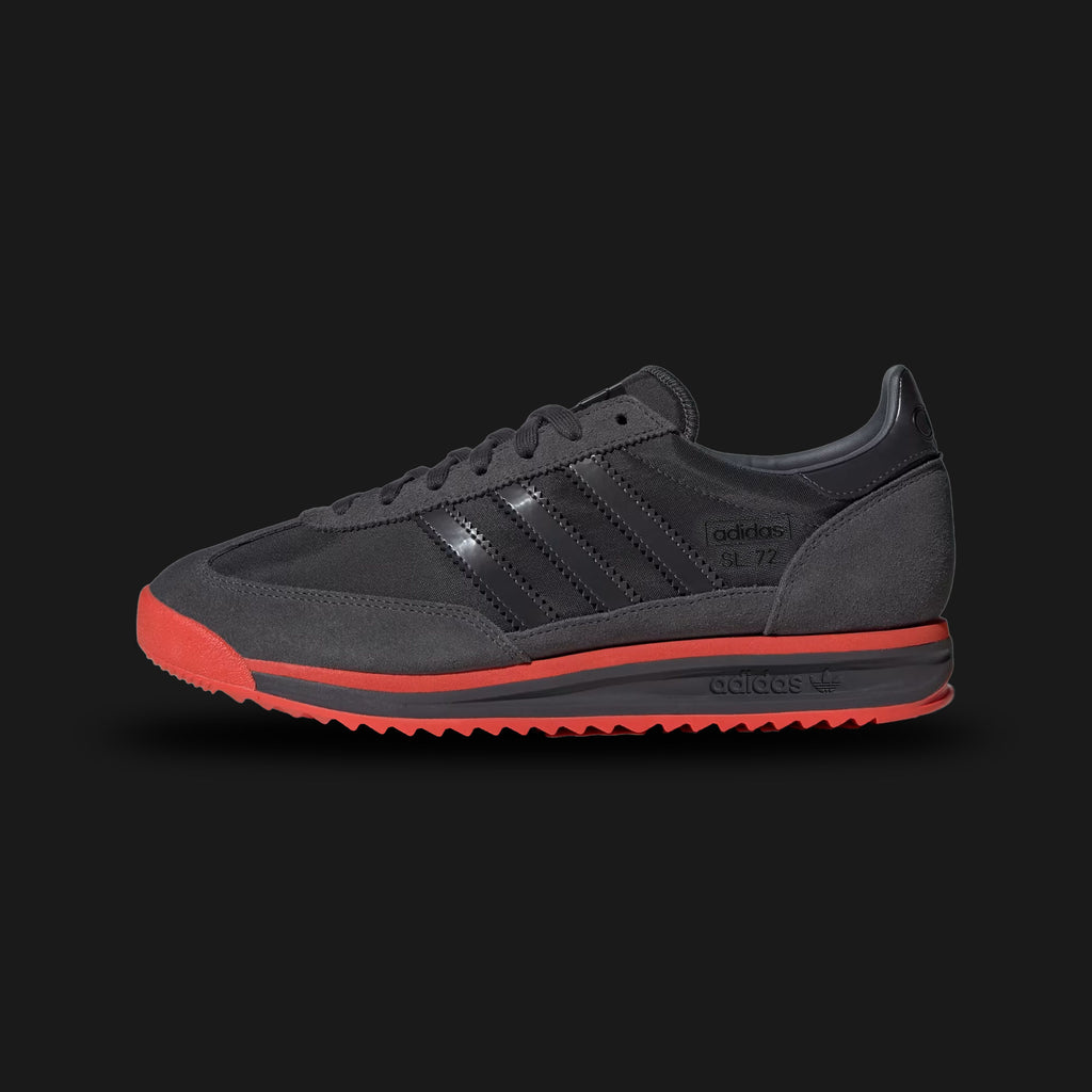 Adidas SL 72 RS Audi Revolut F1 Team shoes in Utility Black and Hi-Res Red (KJ1203). Features a premium reshaped leather and technical textile upper with vibrant red F1 racing accents. Includes collaborative Audi Revolut branding on the tongue and heel, a thickened EVA midsole for modern cushioning, and a signature ripple rubber outsole. Luxuntique offers 100% authentic Adidas F1 gear in Sri Lanka.