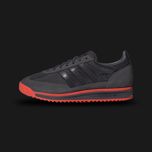 Adidas SL 72 RS Audi Revolut F1 Team shoes in Utility Black and Hi-Res Red (KJ1203). Features a premium reshaped leather and technical textile upper with vibrant red F1 racing accents. Includes collaborative Audi Revolut branding on the tongue and heel, a thickened EVA midsole for modern cushioning, and a signature ripple rubber outsole. Luxuntique offers 100% authentic Adidas F1 gear in Sri Lanka.