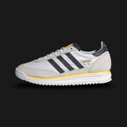 adidas SL 72 RS shoes in Cloud White, Core Black, and Spark yellow (Design Code: IH4823). Featuring a lightweight nylon and suede upper, black leather three-stripes, and a vibrant "Spark" yellow midsole accent. Includes the signature textured tongue and a durable rubber outsole with a retro traction pattern. Luxuntique offers 100% authentic adidas SL 72 sneakers at the lowest price in Sri Lanka.