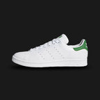 adidas Stan Smith shoes in Cloud White, Core White, and Green (Design Code: GW9253). Featuring the iconic smooth synthetic upper made with Primegreen high-performance recycled materials. Accented by the classic Green heel tab and the signature Stan Smith tongue portrait. Finished with perforated three-stripes and a durable rubber cupsole. Luxuntique offers 100% authentic adidas iconic lifestyle sneakers at the lowest price in Sri Lanka.