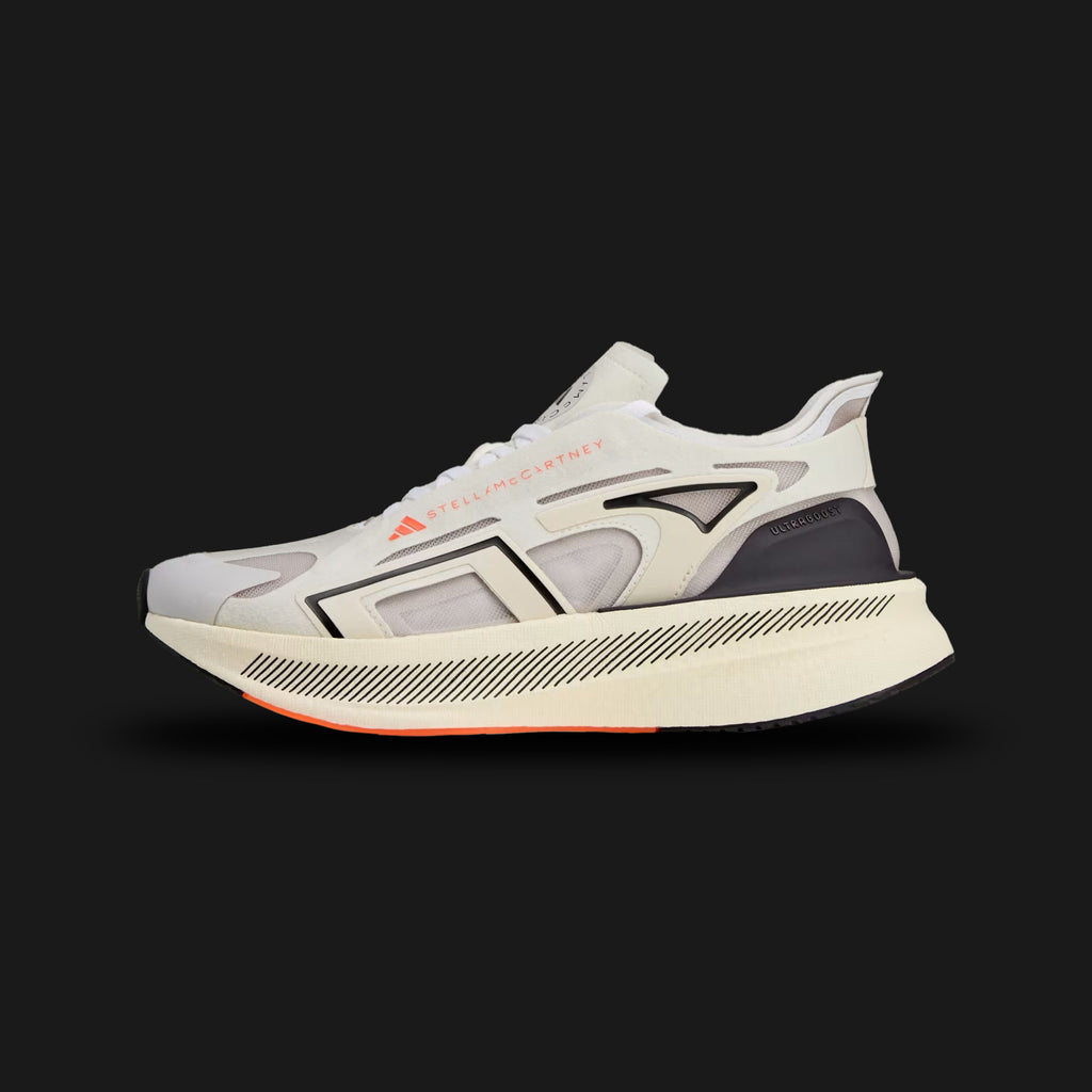 Adidas by Stella McCartney Ultraboost 5 shoes in Ivory, Grey One, and Core Black (JR0665). Features a sustainable, breathable Ivory Primeknit upper encased in distinct Grey One supportive synthetic overlays. Includes a thick, energy-returning white Boost foam midsole, sleek Stella McCartney branding, and a durable Core Black rubber outsole. Luxuntique guarantees 100% authentic Adidas footwear in Sri Lanka.