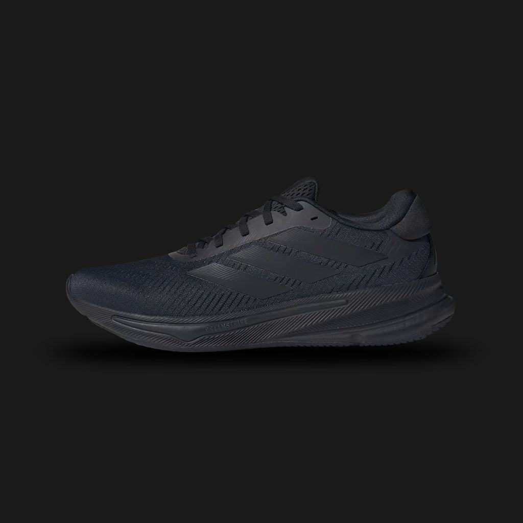 Adidas Supernova Ease shoes in Core Black and Carbon (IH2580). Features a lightweight breathable textile upper, seamless tonal 3-Stripes branding, a responsive Dreamstrike cushioned foam midsole, and a durable rubber outsole. Luxuntique guarantees 100% authentic footwear.