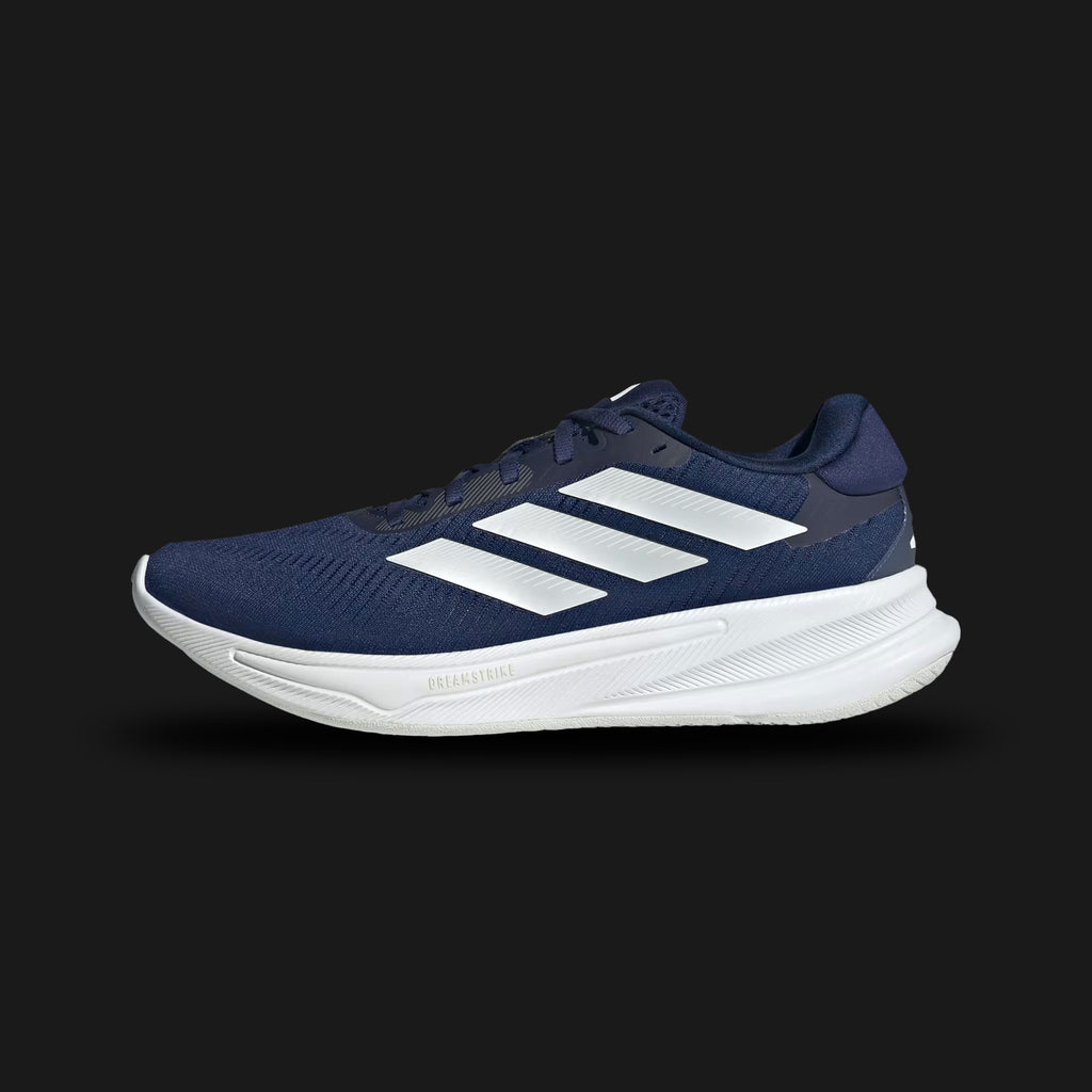 Adidas Supernova Ease shoes in Dark Blue, Zero Metallic, and Charcoal (JH8560). Features a lightweight breathable textile upper, metallic 3-Stripes branding, a responsive Dreamstrike cushioned foam midsole, and a durable rubber outsole. Luxuntique guarantees 100% authentic footwear.