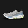 Adidas Supernova Rise 2 running shoes in Grey Two, Matte Silver, and Hi-Res Yellow (IH8708). Features a breathable engineered mesh upper, metallic 3-Stripes, responsive Dreamstrike+ foam cushioning midsole, and Adiwear outsole. Luxuntique guarantees 100% authentic footwear.