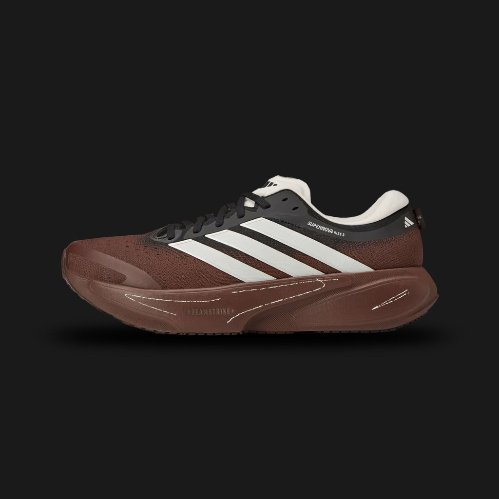 adidas Supernova Rise 3 running shoes in Auburn, Chalk White, and Core Black (KI3616). Features a breathable engineered mesh upper in rich auburn, a plush Chalk White Dreamstrike+ foam midsole for maximum comfort, and a bottom Support Rod system for smooth transitions. Includes a durable Core Black Adiwear outsole. Luxuntique offers 100% authentic adidas in Sri Lanka.