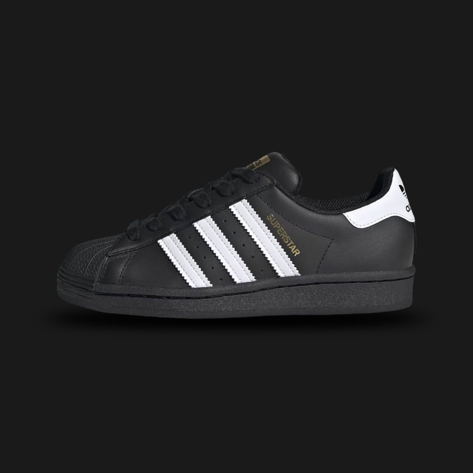Black Adidas Superstar sneaker with white stripes (Design code: EF5398) on a light gray background. Luxuntique offers 100% authentic Adidas sneakers at the lowest prices in Sri Lanka.