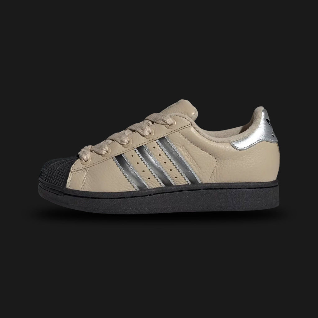 Beige Adidas Superstar II Shoes with black sole and three stripes on a light gray background. Luxuntique offers authentic Adidas footwear at the lowest prices in Sri Lanka.