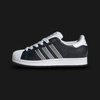 adidas Superstar II shoes in Core Black, Matte Silver, and Cloud White (Design Code: JQ3209). Featuring the iconic white rubber shell toe, serrated Matte Silver three-stripes on a premium black leather upper, and a classic herringbone-pattern rubber cupsole for traction. Luxuntique offers 100% authentic adidas Superstar sneakers at the lowest price in Sri Lanka.