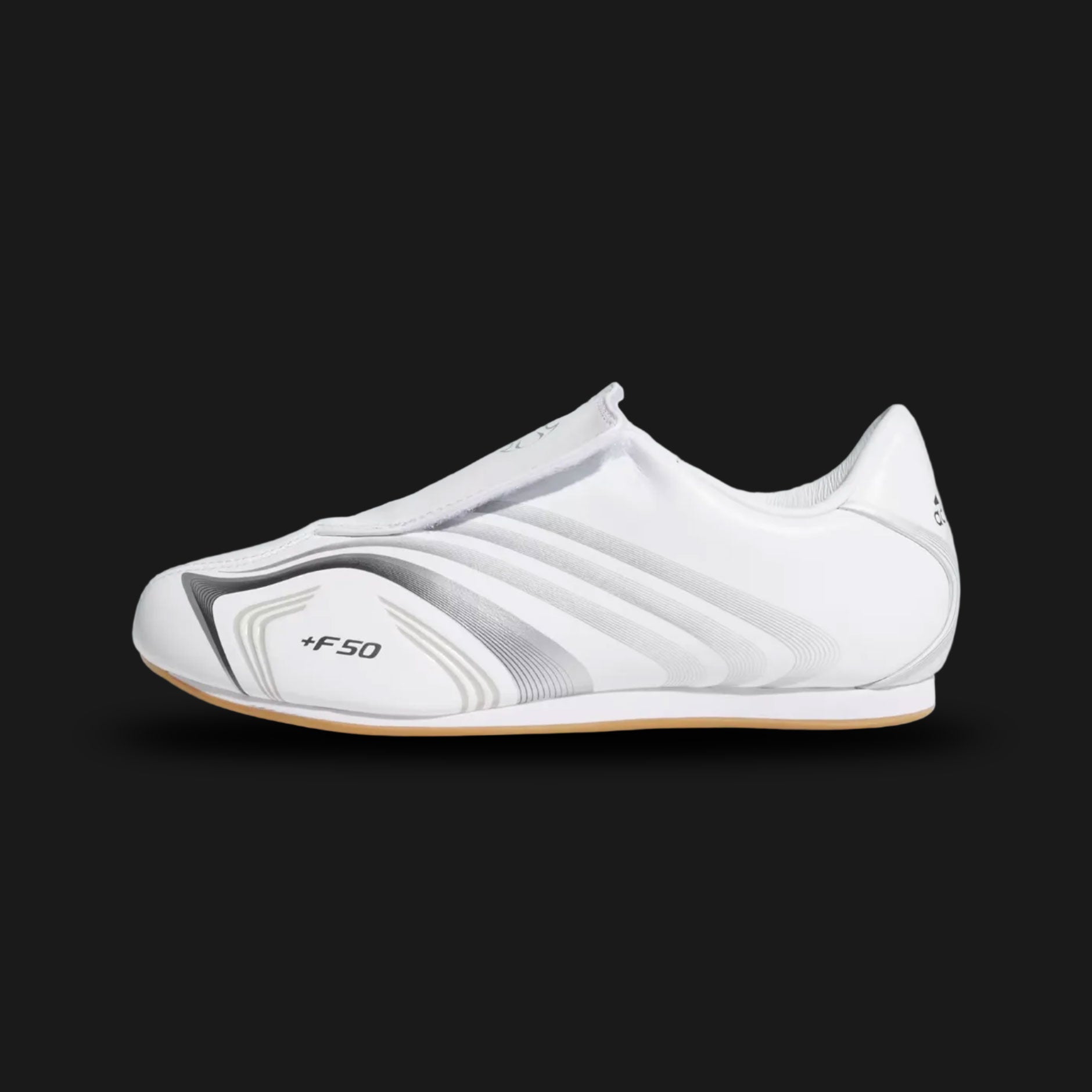 Adidas Taekwondo F50 shoes in Cloud White, Silver, and Iron Metallic (JR6404). Features a sleek Cloud White upper with metallic silver Three Stripes, inspired by F50 speed boot DNA and low-profile martial arts silhouettes. Luxuntique offers 100% authentic Adidas in Sri Lanka.