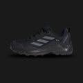 Adidas Terrex Eastrail GORE-TEX men's hiking shoes in Core Black and Grey Four (Design Code: ID7845). Featuring a waterproof, breathable GORE-TEX membrane to keep feet dry, a high-traction Traxion rubber outsole for superior grip on slippery terrain, and a lightweight EVA midsole. Luxuntique offers 100% authentic Adidas Terrex sneakers at the lowest price in Sri Lanka.