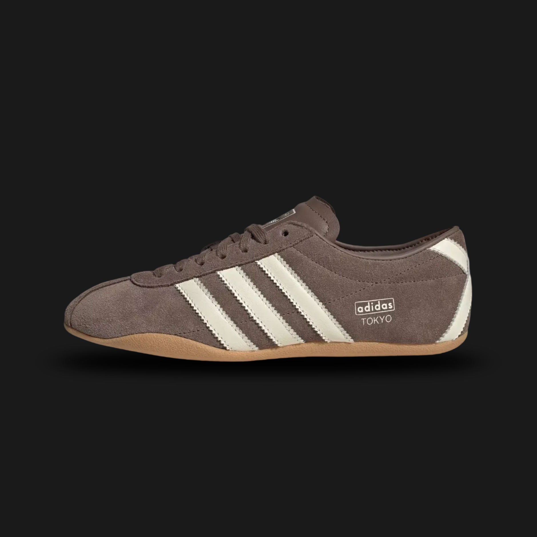 Adidas Tokyo in Earth Strata, Off White, and Gum (KI3584). Features a premium Earth Strata brown suede and leather upper with Off White Three Stripes and a classic low-profile gum rubber outsole. Iconic Tokyo heritage design with a slim silhouette. Luxuntique offers 100% authentic Adidas in Sri Lanka.