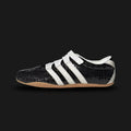 Adidas Tokyo Mary Jane shoes in Core Black, Off White, and Gum (KI4313). Features a sleek terrace-inspired Mary Jane silhouette with a premium Core Black suede upper and an adjustable midfoot strap. Includes iconic Off White 3-Stripes, subtle branding, and a durable retro Gum rubber outsole. Luxuntique guarantees 100% authentic Adidas footwear in Sri Lanka.