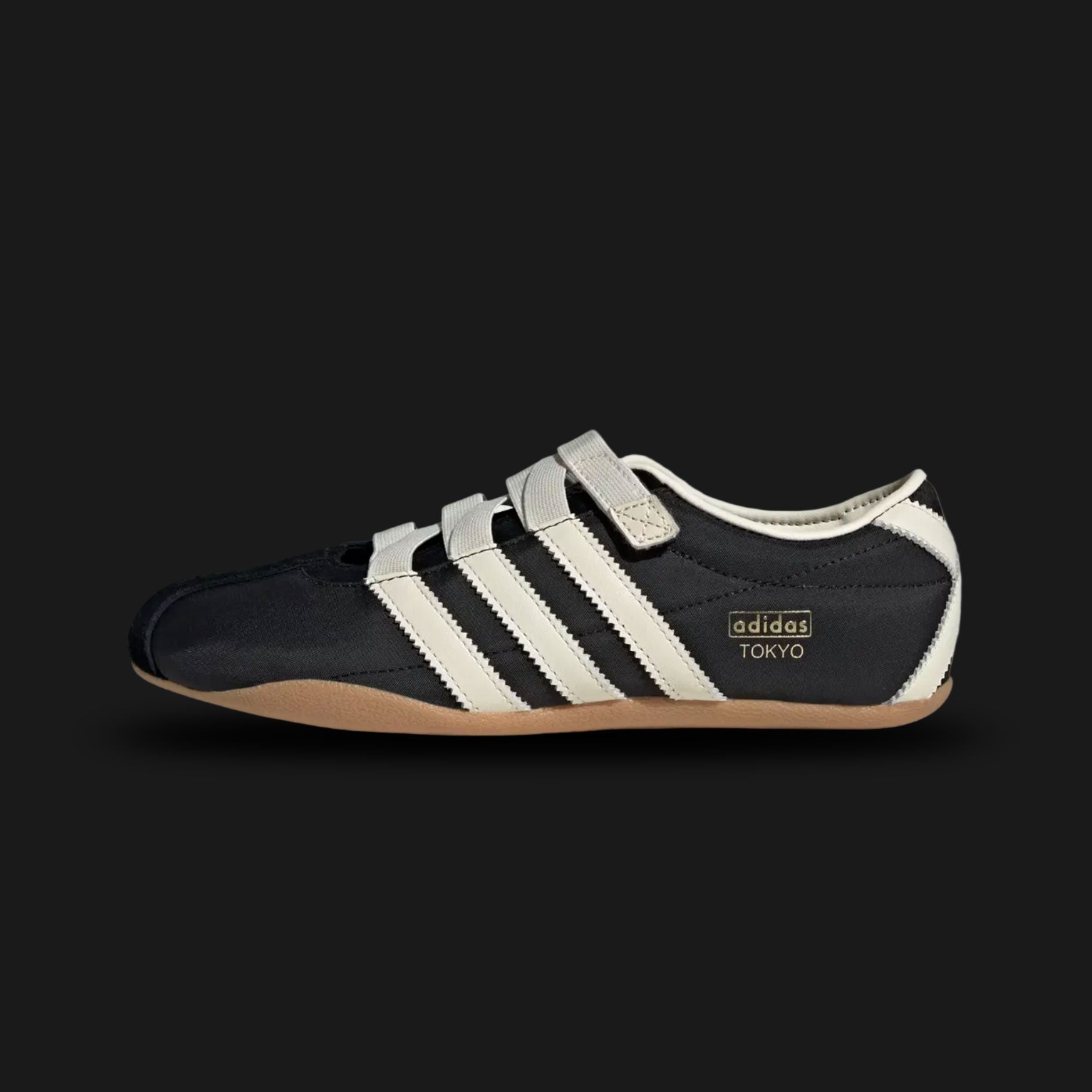 Adidas Tokyo MJ shoes in Core Black, Cream White, and Gold Metallic (JR4790). This Mary Jane-inspired sneaker features a premium black leather upper with a signature strap, cream white Three Stripes, and gold foil branding. Low-profile heritage design with a slim rubber sole. Luxuntique offers 100% authentic Adidas in Sri Lanka.